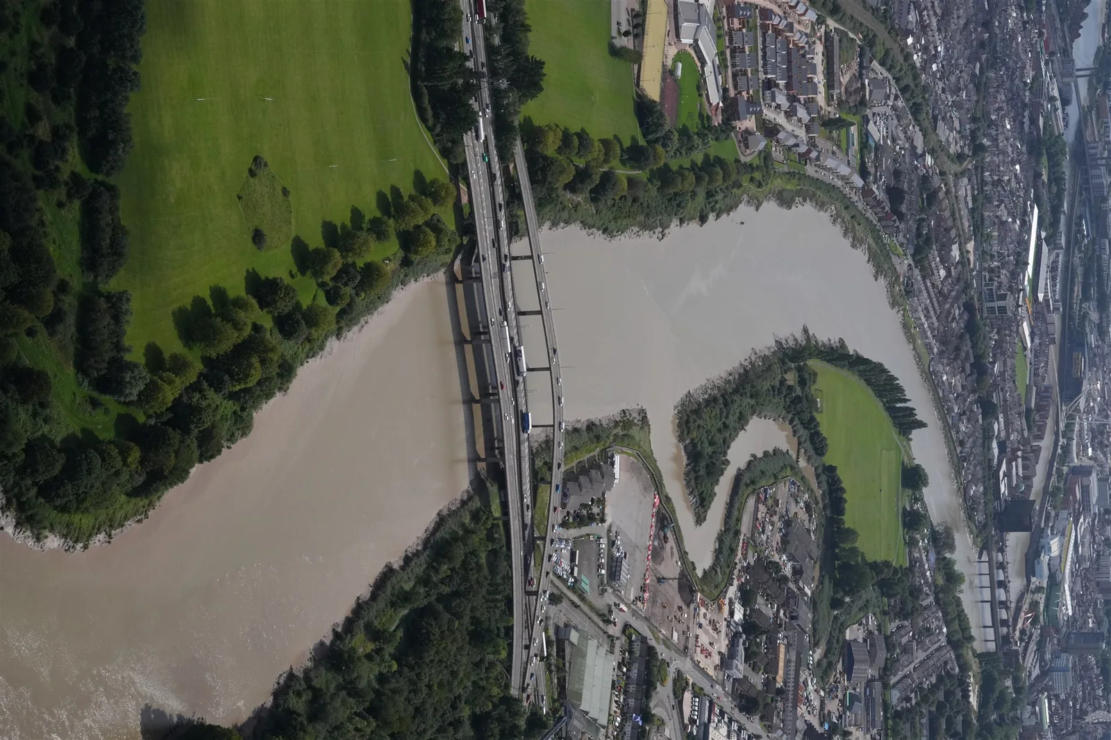 Top-down aerial view of a major road bridge crossing a river