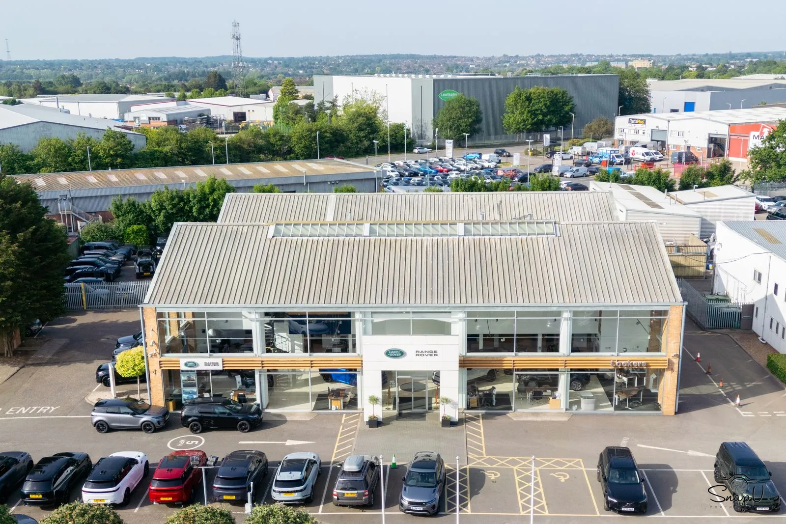 Aerial drone photo of a car dealership and forecourt for commercial business marketing