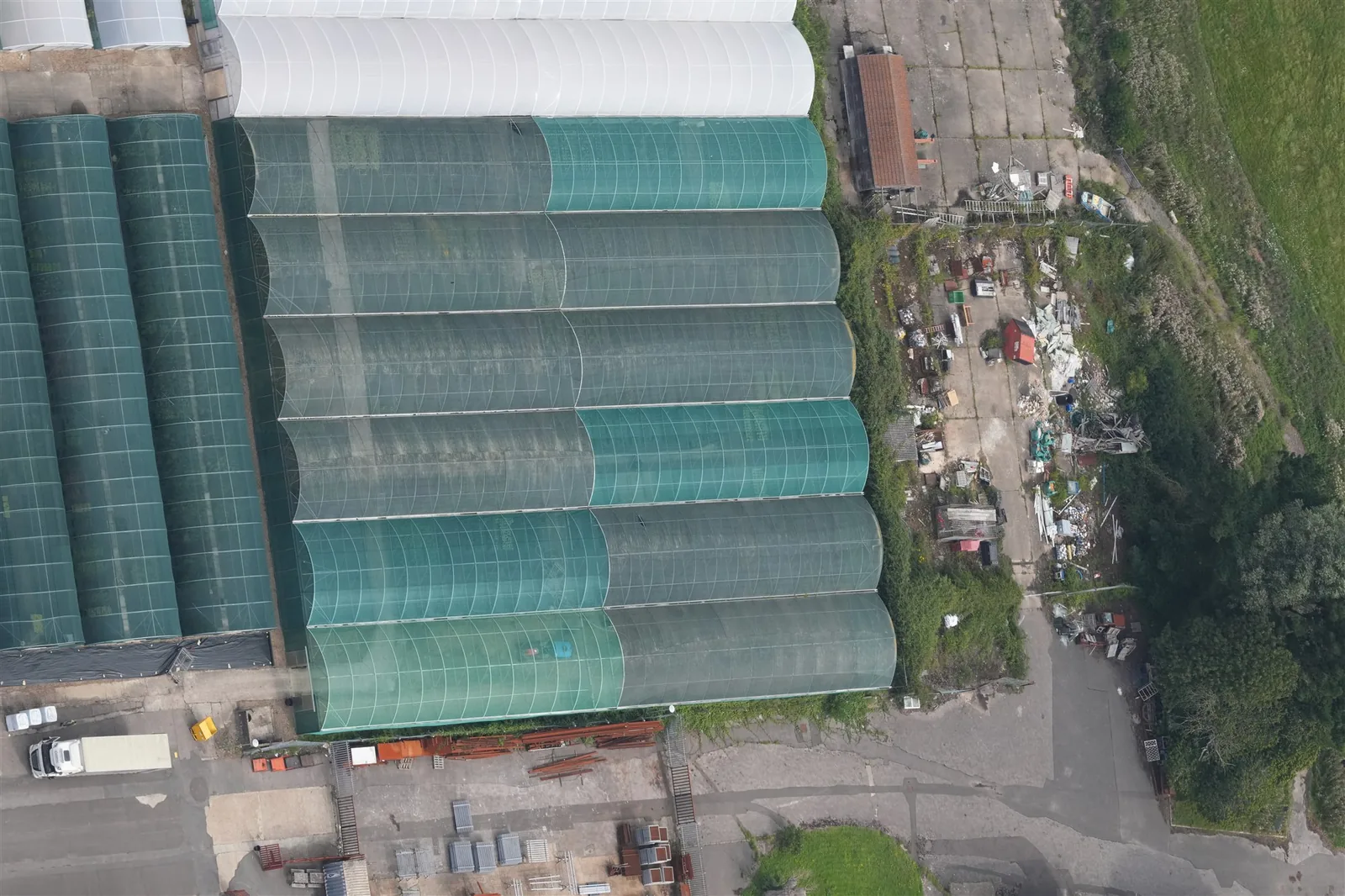 Top-down aerial photograph of a commercial greenhouse and nursery site