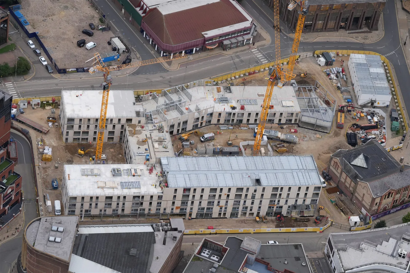 Aerial photograph showing cranes and active work on a city-centre construction project