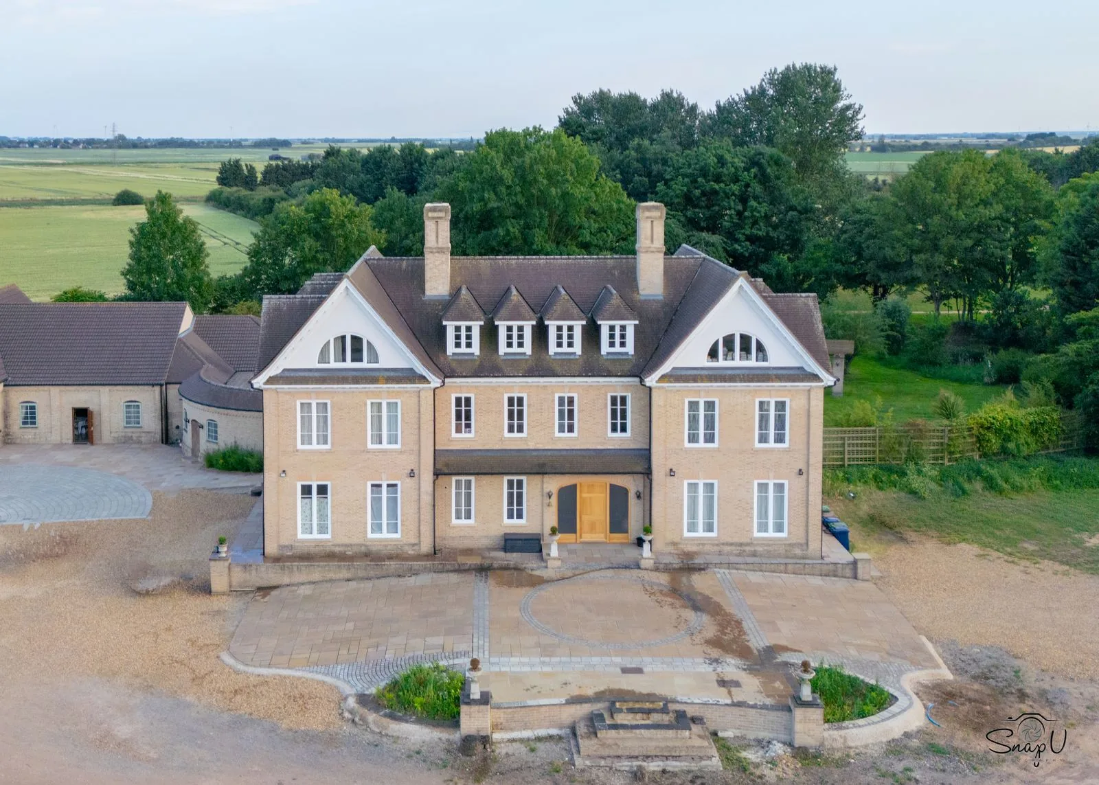 Aerial photography of a country manor estate house in the UK countryside