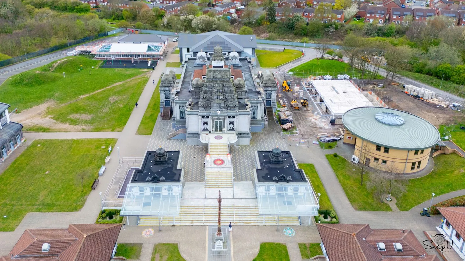 Symmetrical aerial drone photograph of a landmark temple building and grounds UK