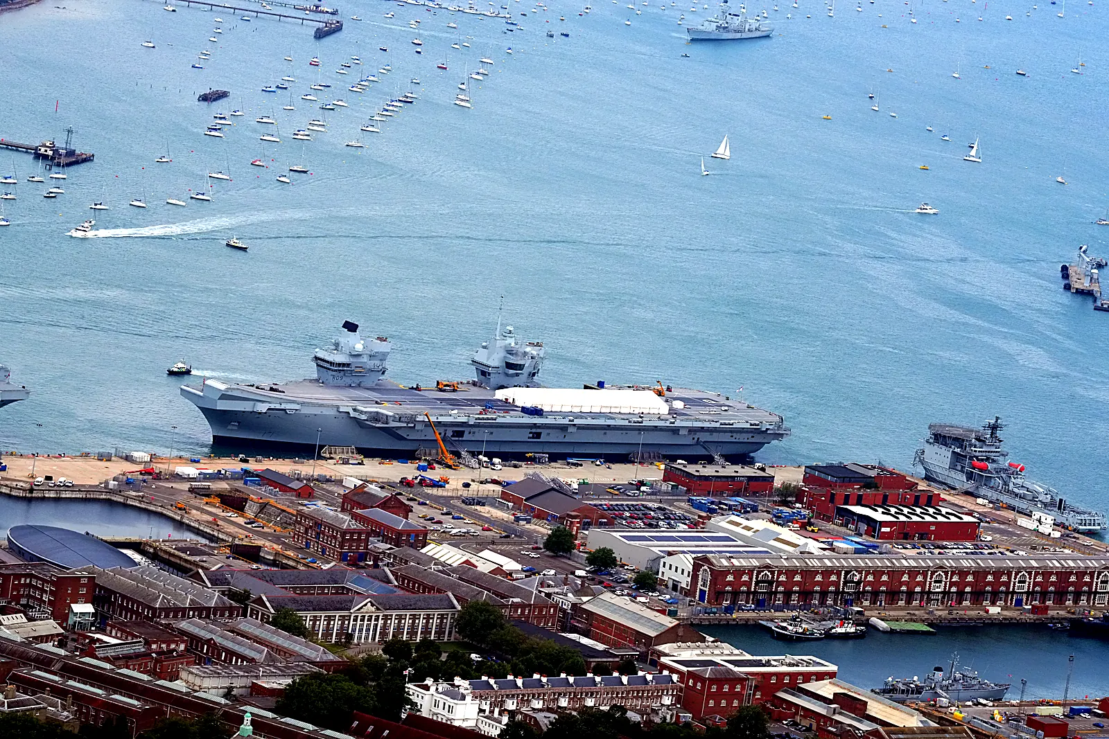 Aerial photograph of two Royal Navy aircraft carriers berthed at Portsmouth Naval Base