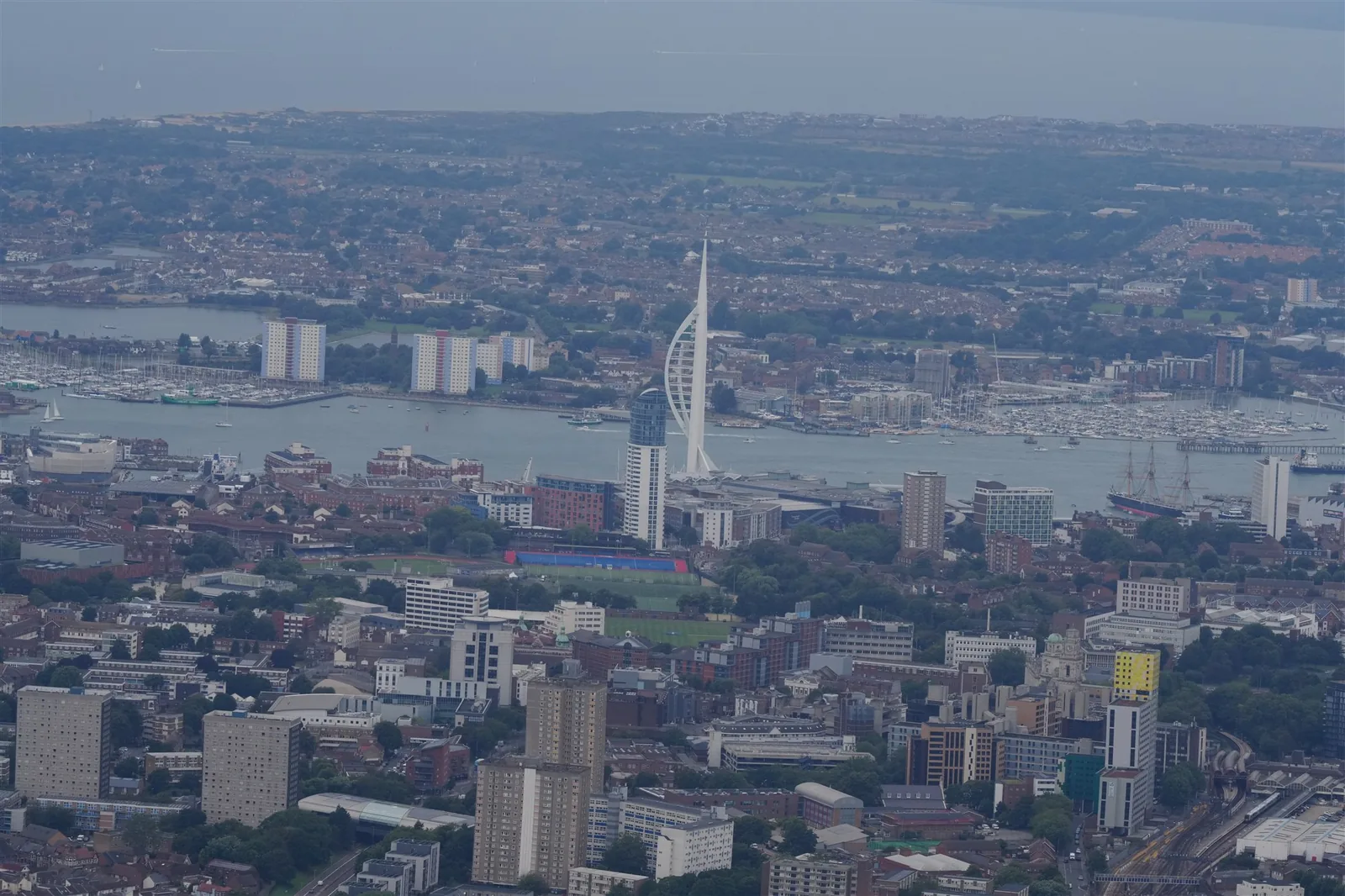 Aerial city and harbour view showing the Spinnaker Tower and waterfront